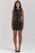 Mini black leather dress by MANDOTOS, featuring a fitted silhouette and stylish design, shown on a model.