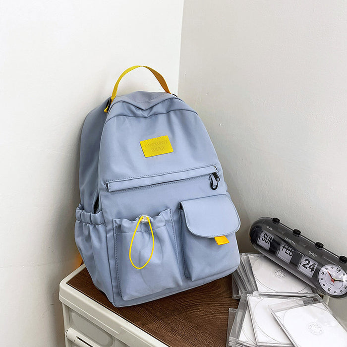 Ancient Energy nylon school backpack for junior high students, featuring multiple compartments and adjustable straps.