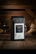 Gun Powder Grinds Peru Decaf on wooden surface