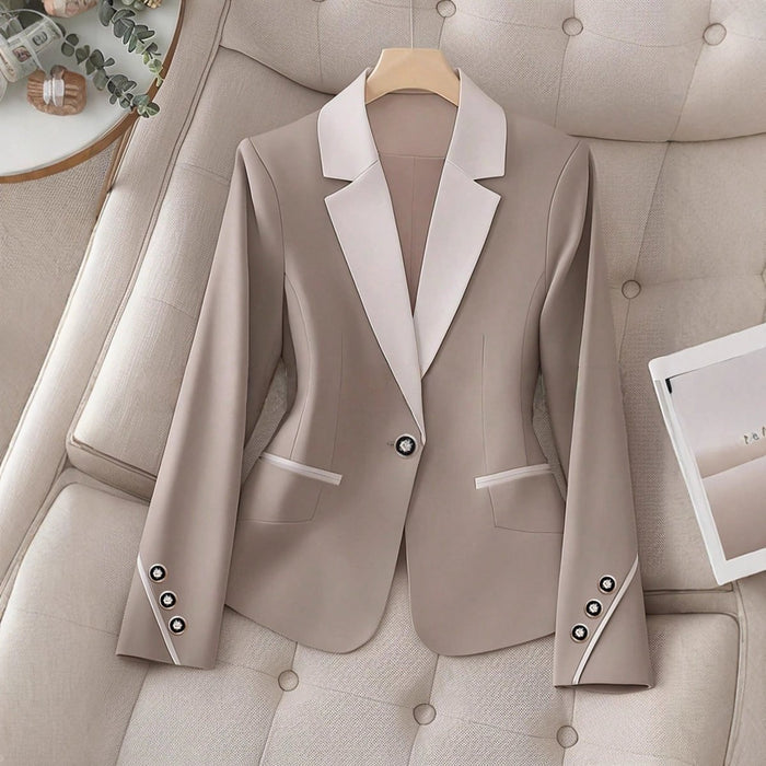 Elegant formal blazer by Ancient Energy featuring contrasting color buttons and a tailored fit for professional or dressy occasions.