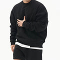 Loose men's round neck pullover sweater by MANDOTOS, showing a comfortable fit and soft knit fabric.
