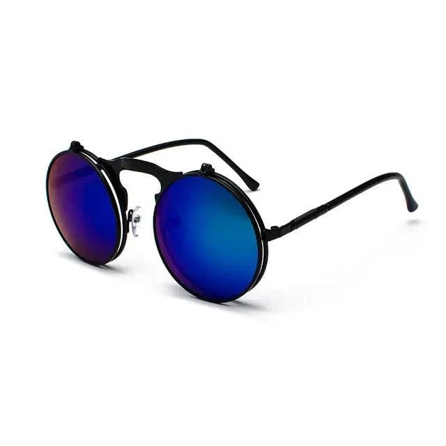 Retro flip steampunk sunglasses by MANDOTOS with metallic frames and tinted lenses, stylish vintage-inspired eyewear.