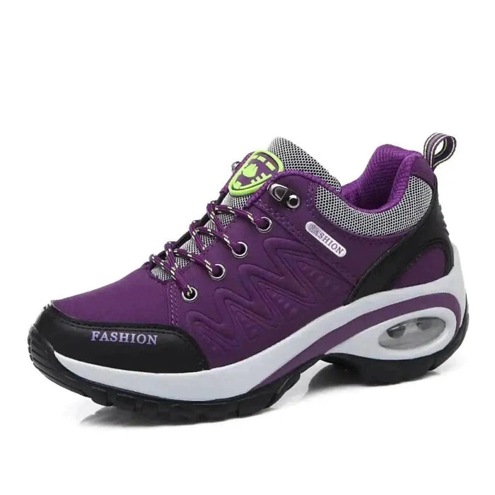 Mandotos running shoes in black and white with cushioned soles and breathable mesh upper for comfortable athletic wear.