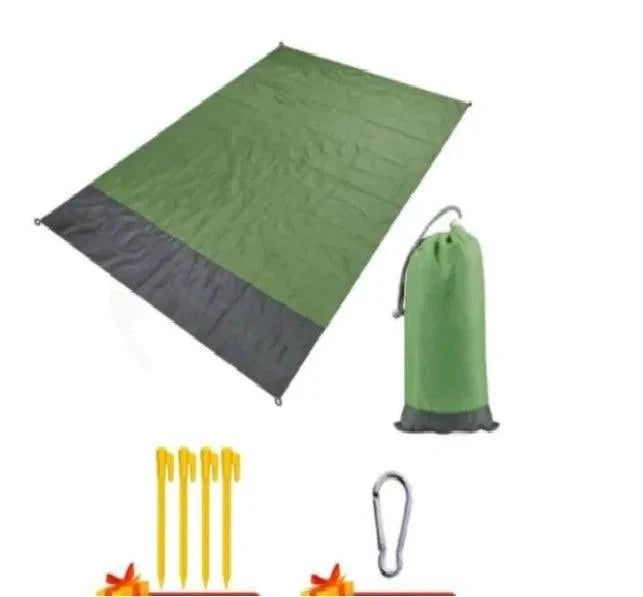 Mandotos sandproof portable beach mat spread on sandy shore, lightweight and foldable for easy beach outings.