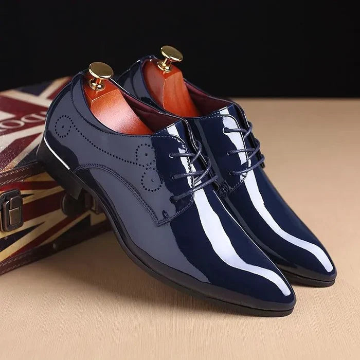 Mandotos sleek leather Oxford shoes with polished finish, classic lace-up design, and elegant craftsmanship for formal wear.