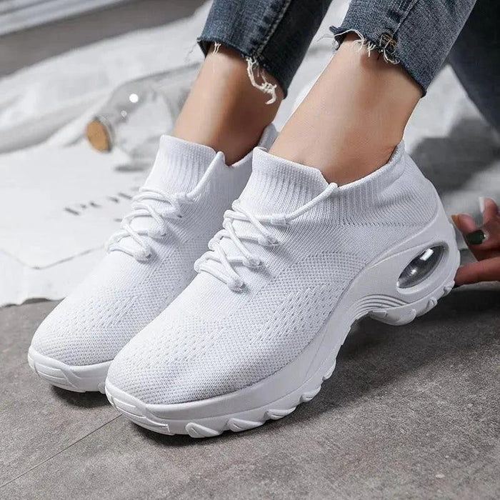 Mandotos women's sports shoes with flying knit sock design, lightweight and flexible for active wear.