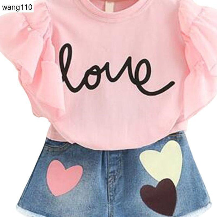Pink 'love' graphic tee with ruffle sleeves & heart-patch denim skirt, kids fashion set