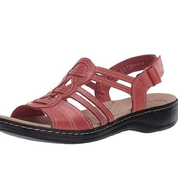 Trendy women's beach sandals by MANDOTOS INTERNATIONAL featuring stylish straps and comfortable flat sole for summer wear.