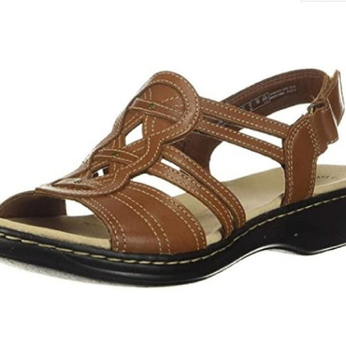 Trendy women's beach sandals by MANDOTOS INTERNATIONAL featuring comfortable straps and stylish design.