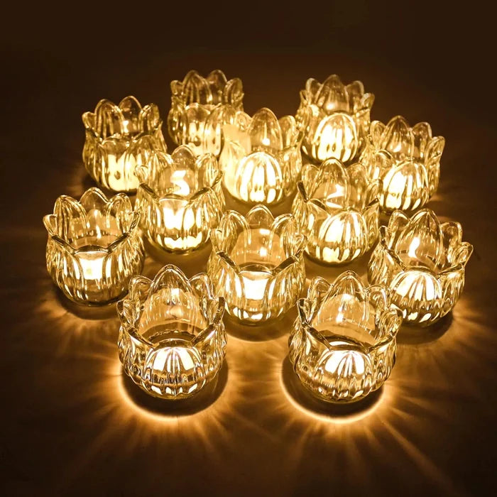 Set of 12 glass tea light holders in tulip glow design by Mandotos International, perfect for ambient candlelit decor.
