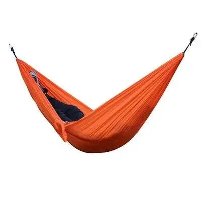 Mandotos Ultimate Oasis single and double hammock shown in lush outdoor setting, featuring woven fabric and sturdy wooden spreader bars.