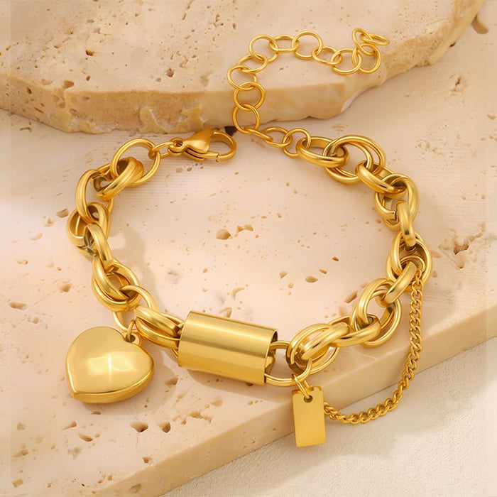 Ancient Energy titanium bracelet featuring a heart-shaped pendant, sleek and versatile jewelry design.