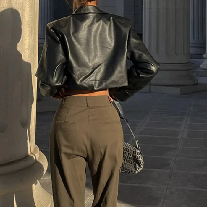 Mandotos International Vogue PU cropped jacket featuring a stylish design and fitted silhouette on a plain background.