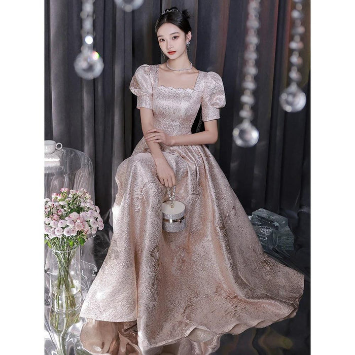 Elegant women’s champagne evening dress by Ancient Energy, featuring a flowing silhouette and stylish design.