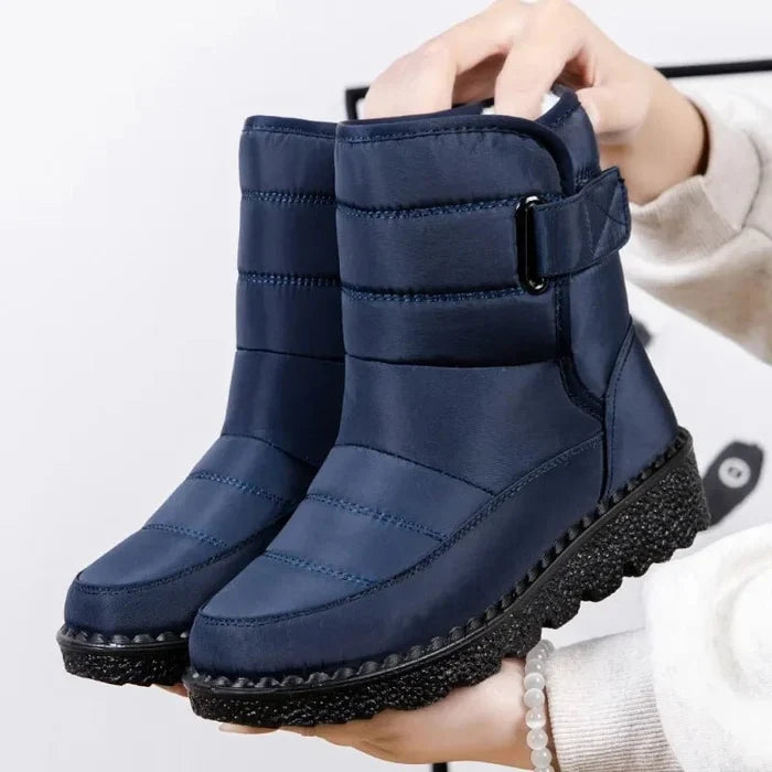 Women's waterproof winter snow boots by MANDOTOS INTERNATIONAL, non-slip ankle boots with warm platform soles, suitable for cold weather.