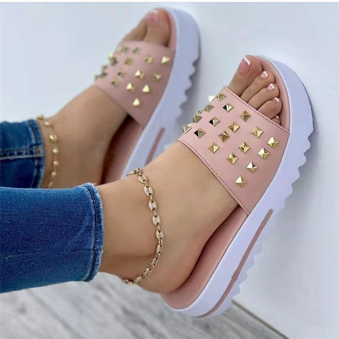Women's wedge and rivet beach flip-flops by Ancient Energy, featuring comfortable straps and stylish wedge heel for summer wear.