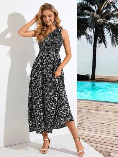 Mandotos Zoe asymmetrical midi dress in lightweight fabric, featuring a flowing silhouette and stylish design.